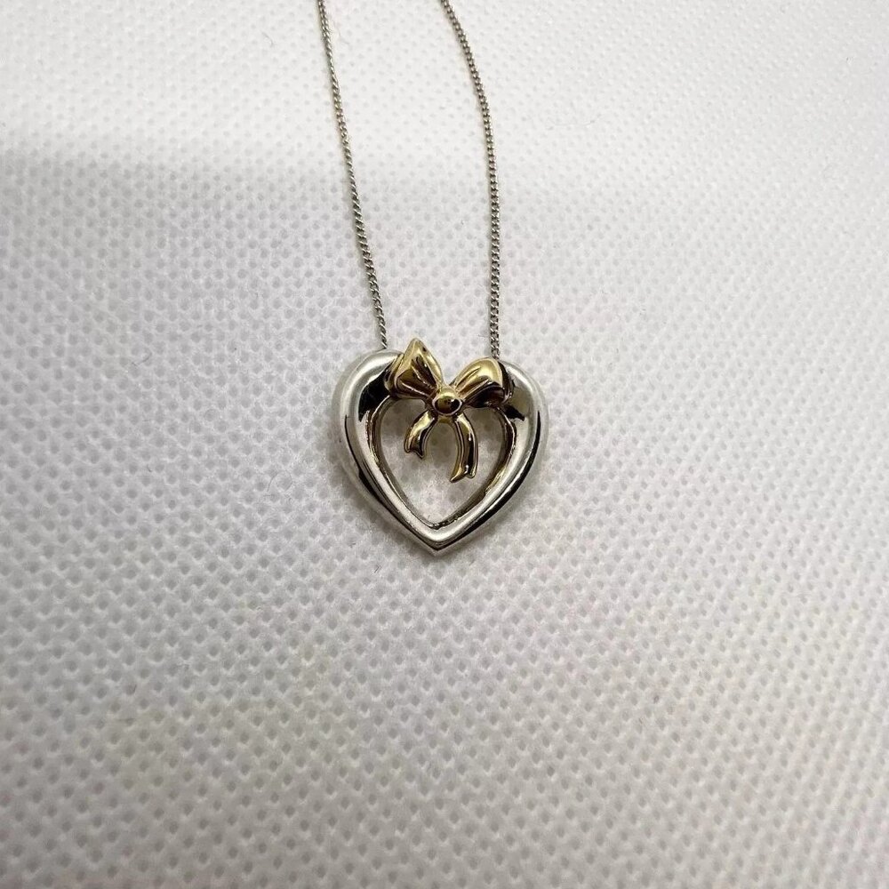 Like New, Tiffany & Co. Sterling Silver and 18K Bow Heart Necklace